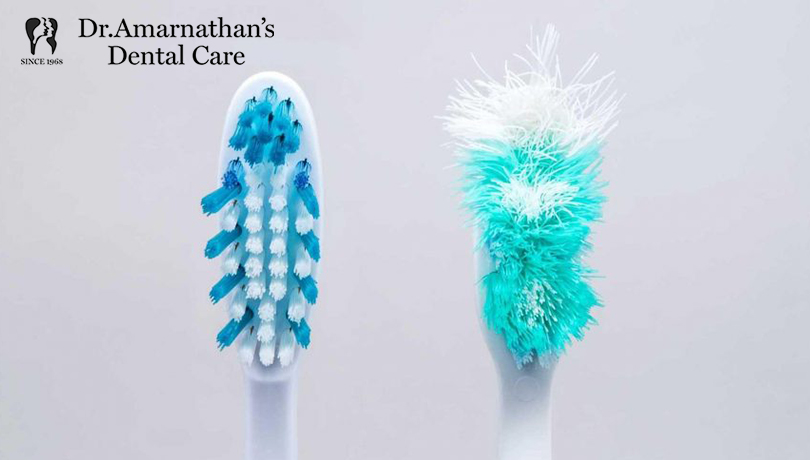A new toothbrush and a frayed toothbrush