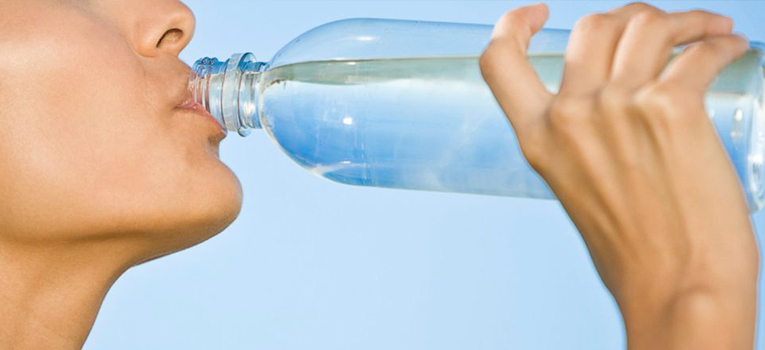 A woman drinks water